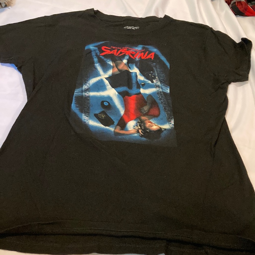 Sabrina black T-shirt tag says 2X more like a modern L